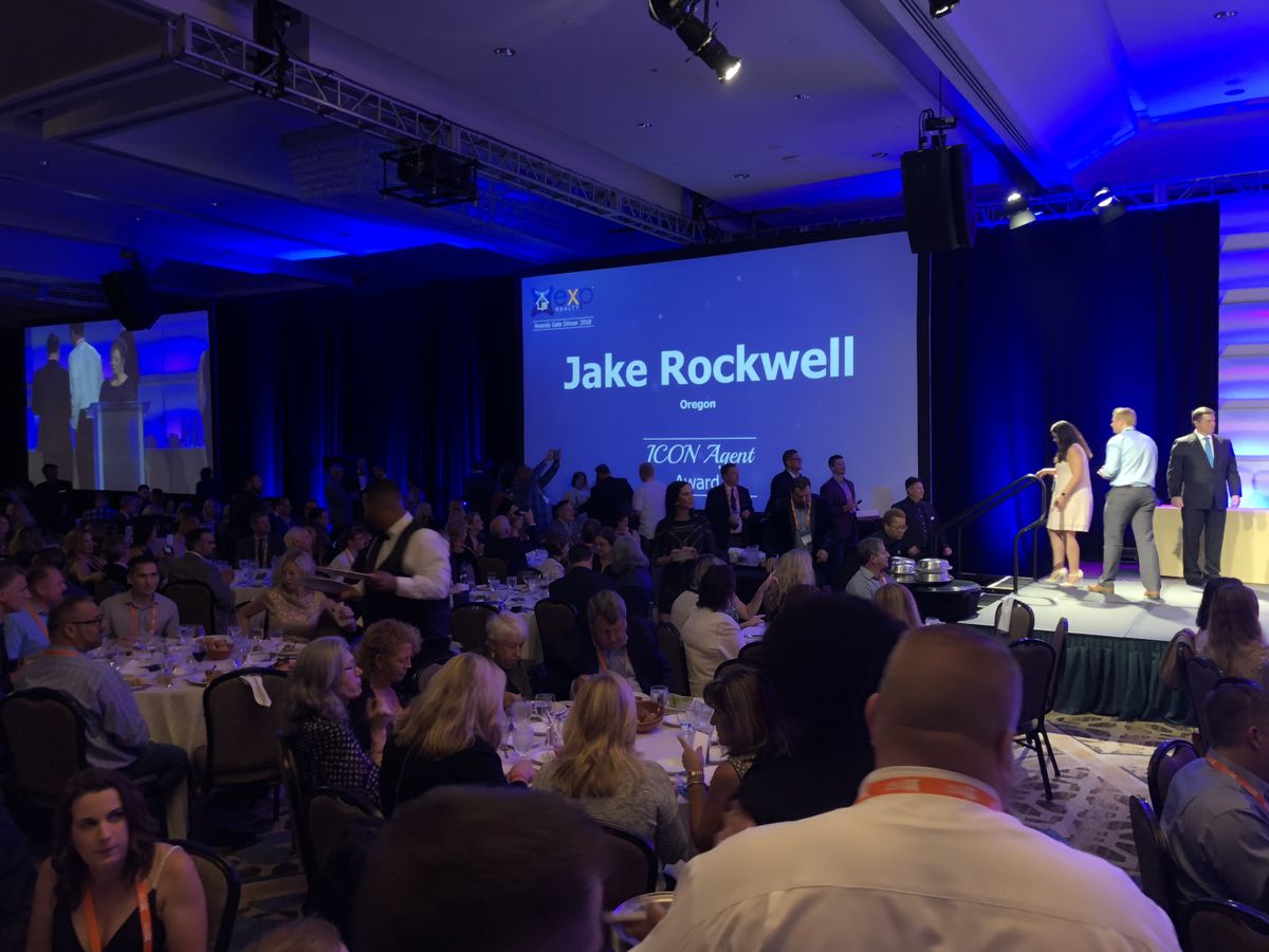Jake Rockwell's name on screen at the 2018 eXp Realty ICON Agent Award ceremony